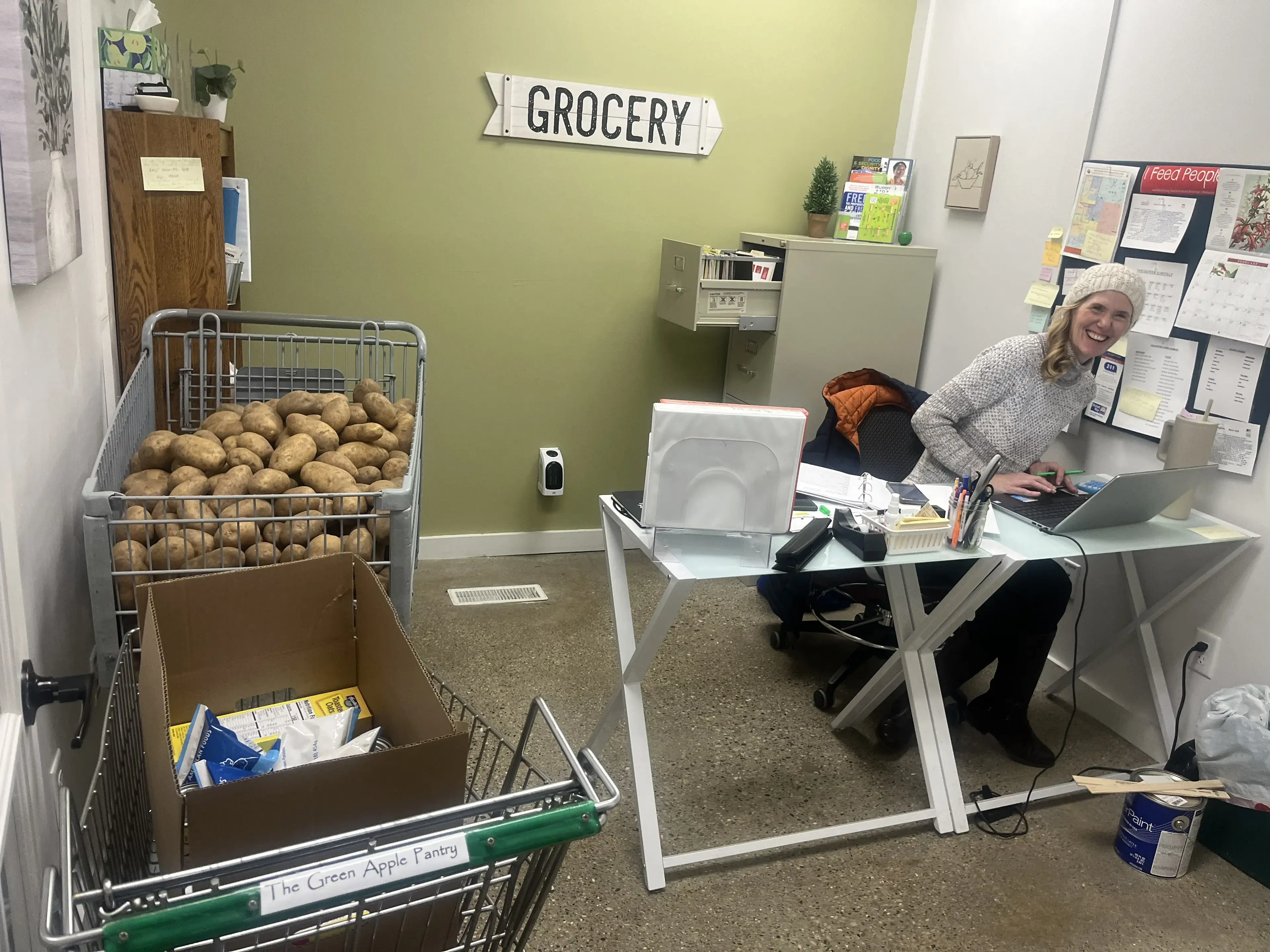 Volunteers sorting and packing groceries at The Green Apple Pantry